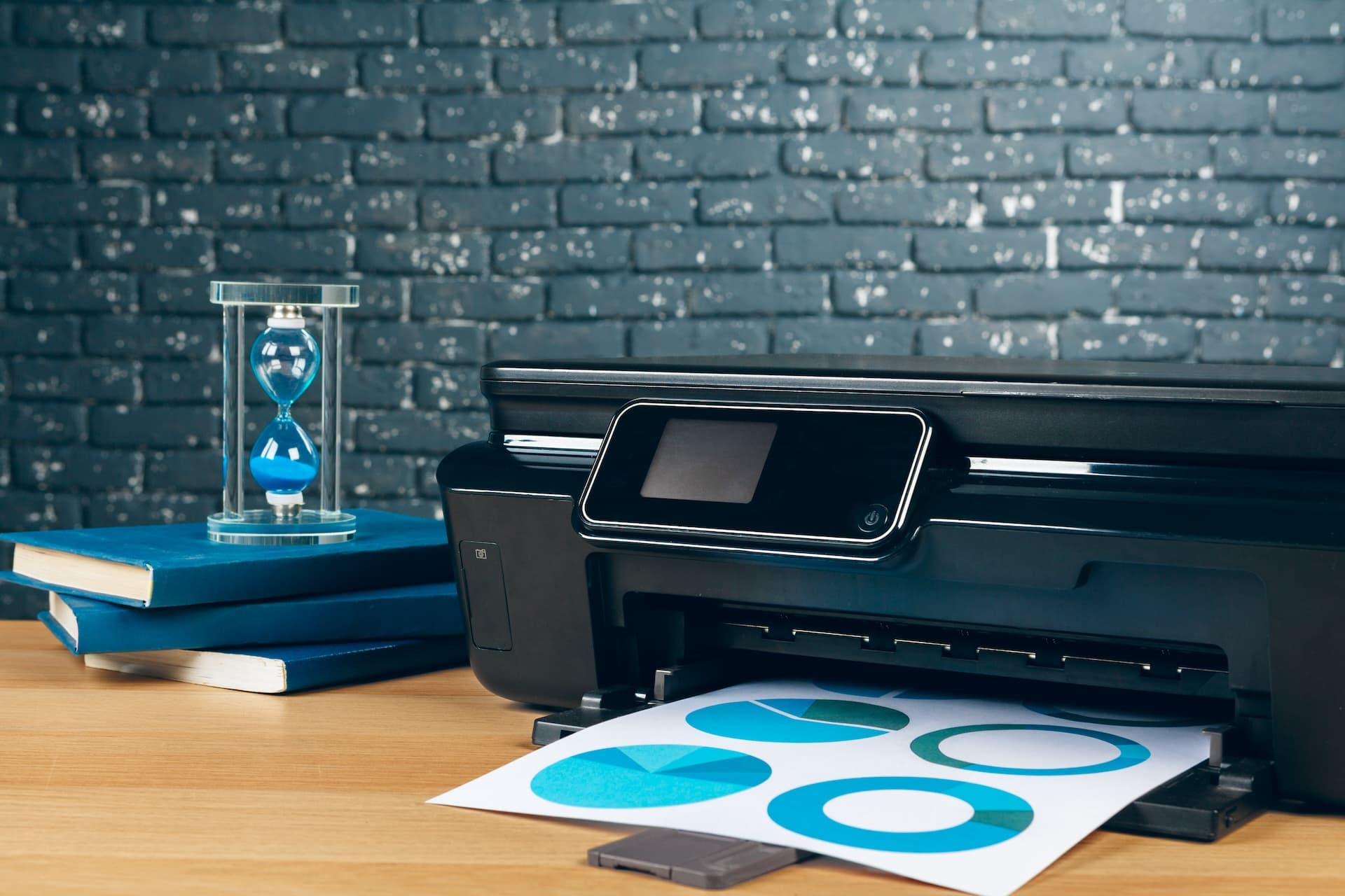Printer producing a freshly printed colour sheet at the Lily Print shop